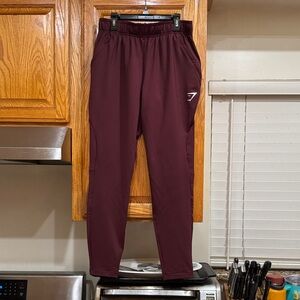MEN’s Gymshark Burgundy Joggers with Logo size SMALL (28-30)